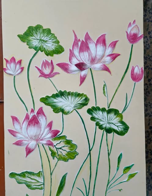 Hand-painted lotus mural by Supi, with pink and white blooms on a cream wall